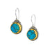 Pair of earrings with turquoise stones and plated gold accents on a white background