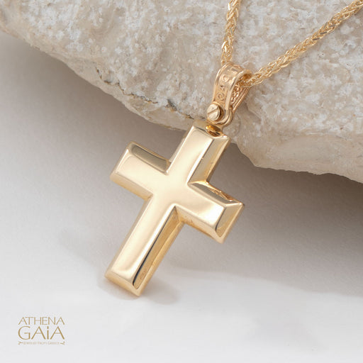 beveled yellow gold Baptism cross on a white background