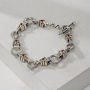Silver bracelet with gemstone accents