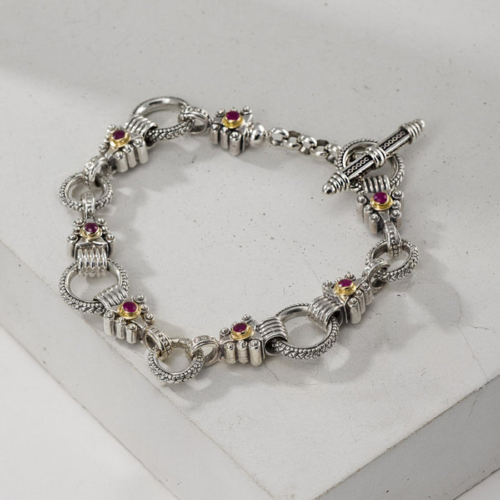 Silver bracelet with gemstone accents