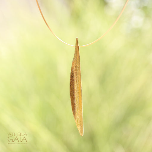 Gracefully shaped and gold-plated, this pendant captures the essence of an olive leaf — a timeless Greek symbol of peace and prosperity.