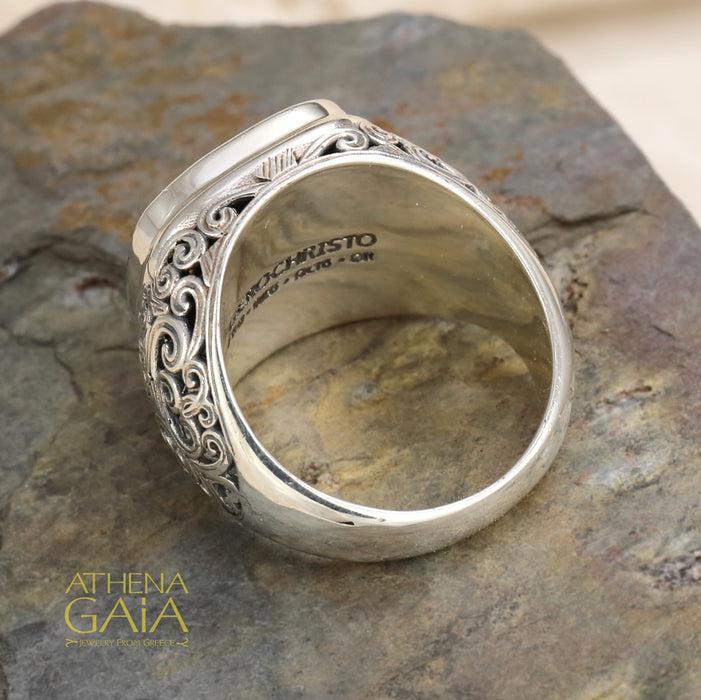 Men’s silver ring with ornate filigree sides and gold scrollwork face, handcrafted Greek design.