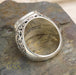 Men’s silver ring with ornate filigree sides and gold scrollwork face, handcrafted Greek design.