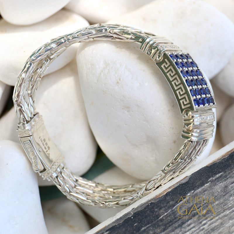 Silver bracelet with blue stones on pebbles