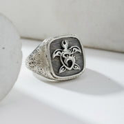 Silver ring with turtle design